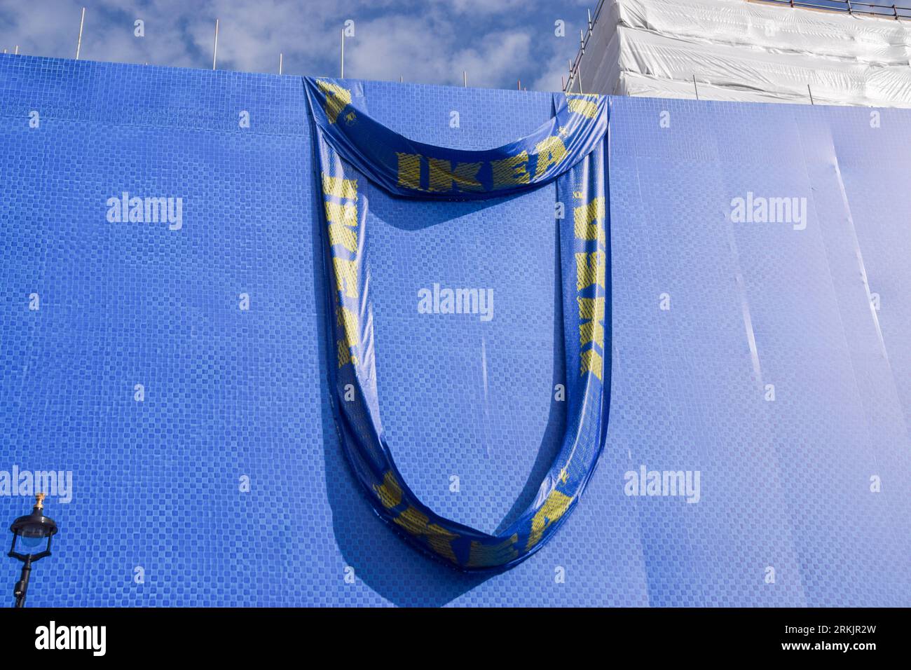 London, UK. 25th August 2023. A giant Ikea shopping bag covers the