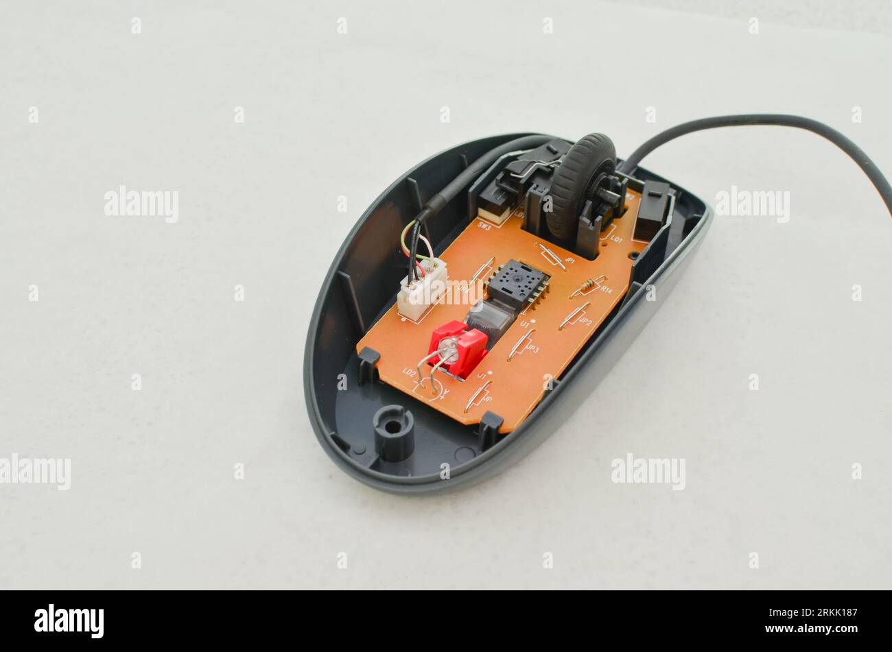 Open computer mouse with exposed electronic circuit for maintenance ...