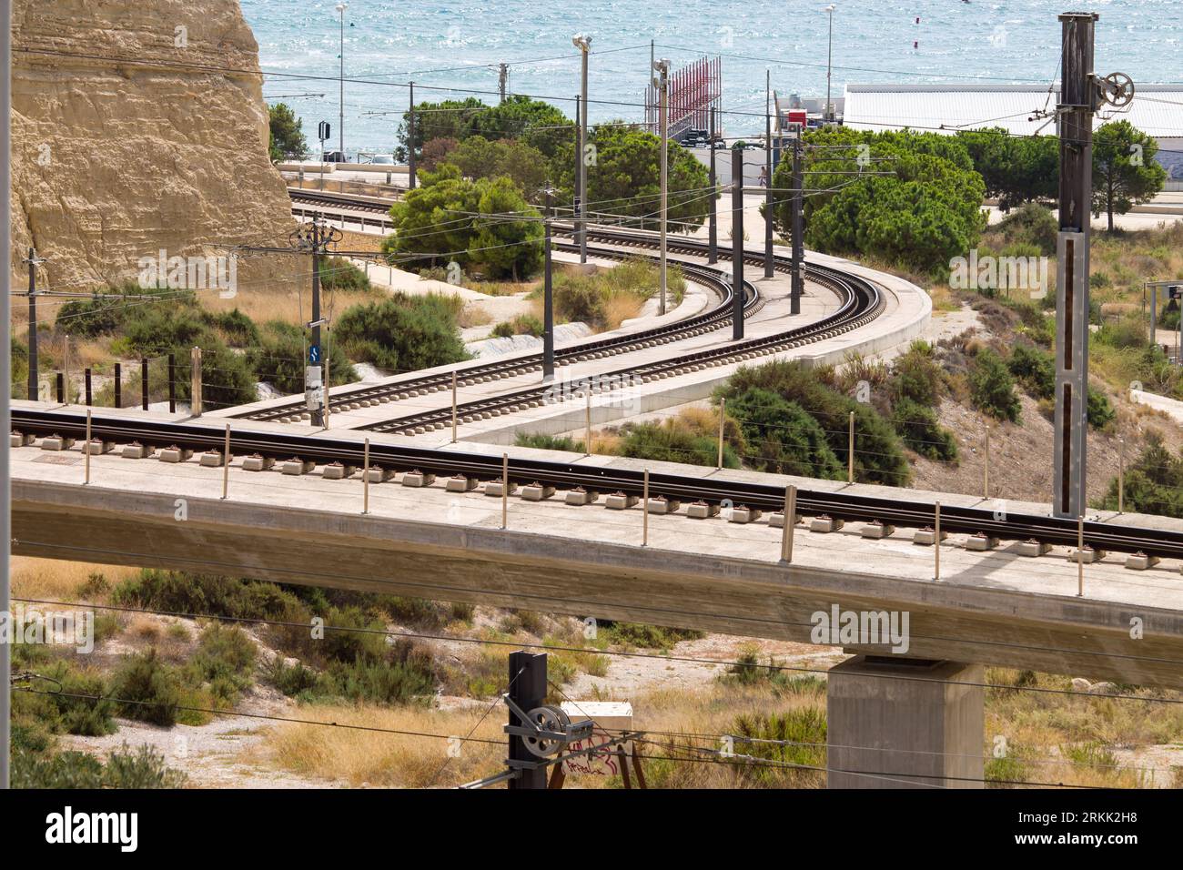 Train tracks in the city of Alicante facing the Mediterranean Sea Stock Photo