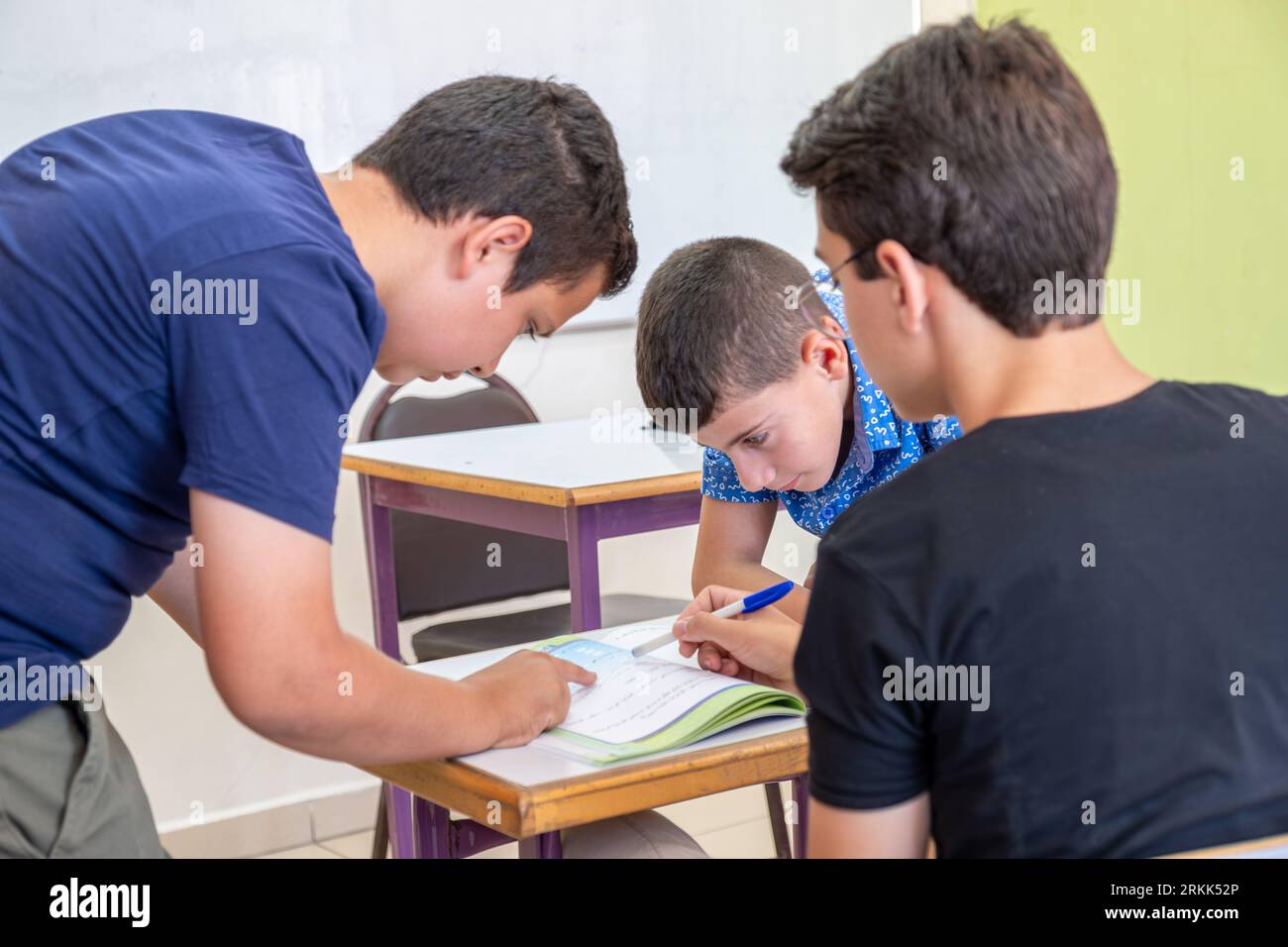 group of students in school having discussion about some studying fields Stock Photo