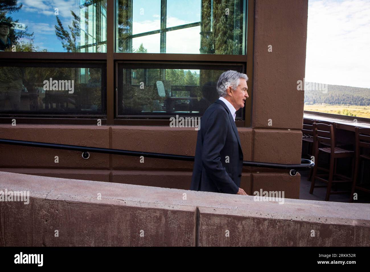 Federal Reserve Chairman Jerome Powell takes a break outside of Jackson ...