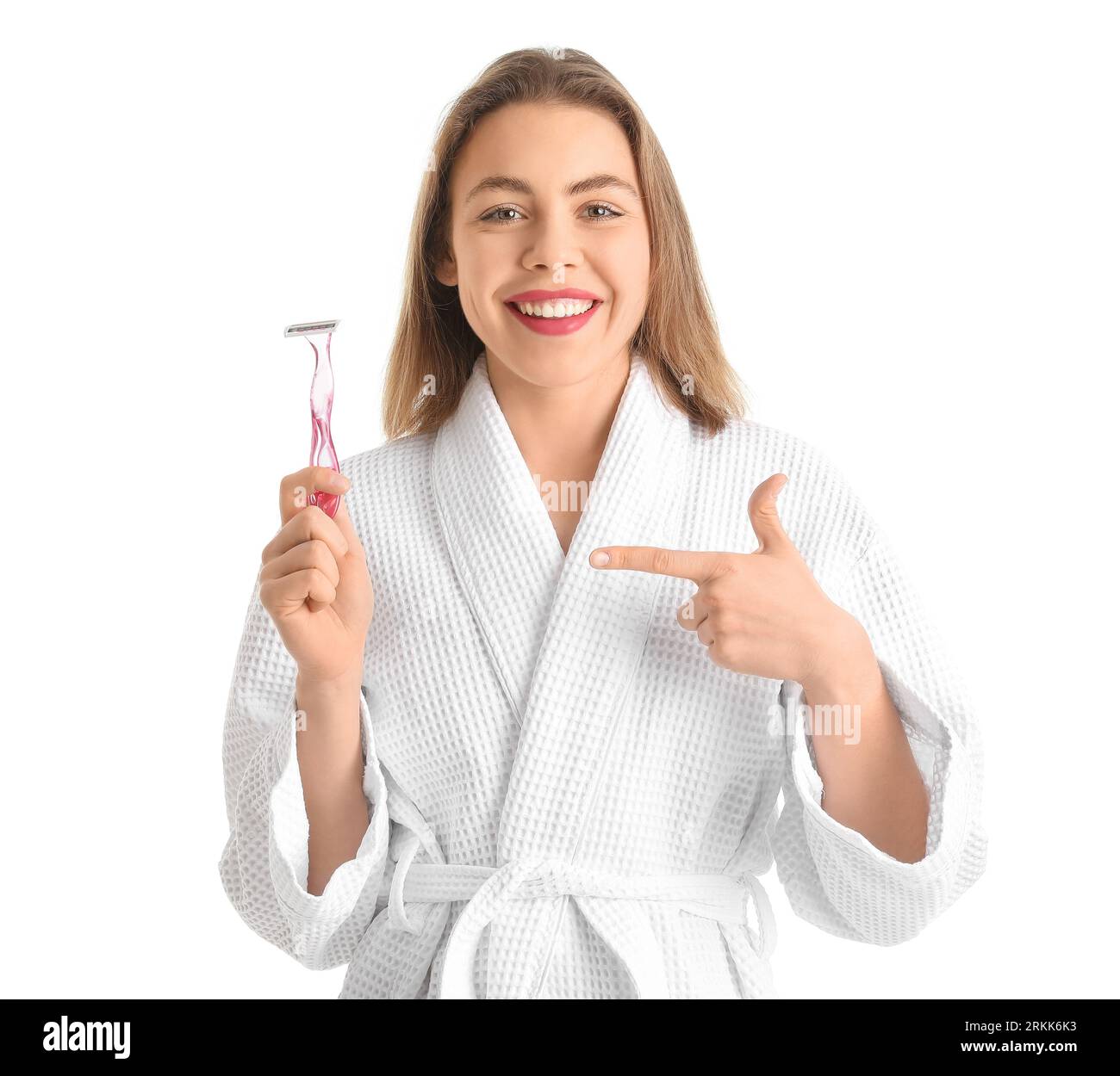 Young woman pointing at razor on white background Stock Photo Alamy