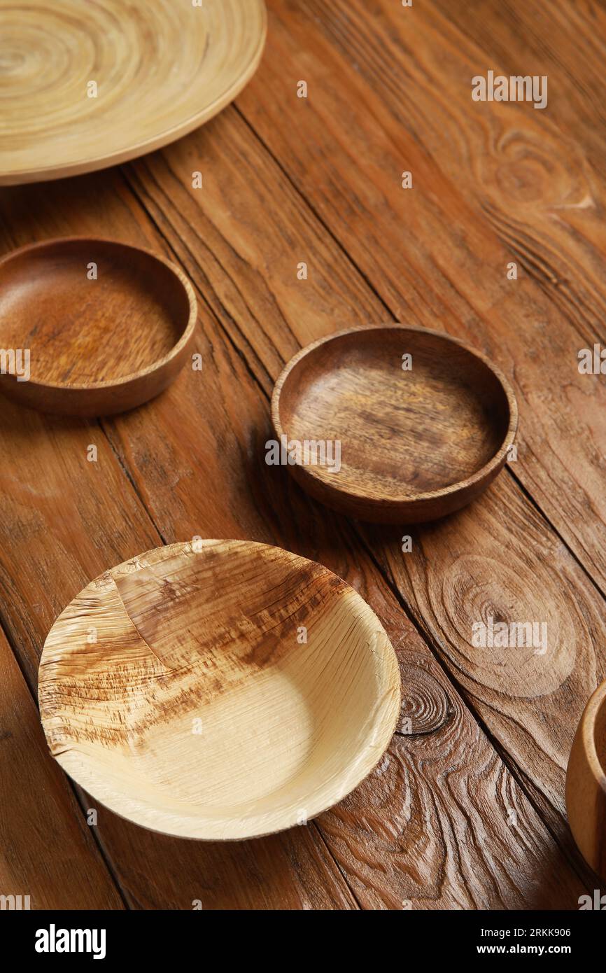 Plates and bowl on wooden background Stock Photo