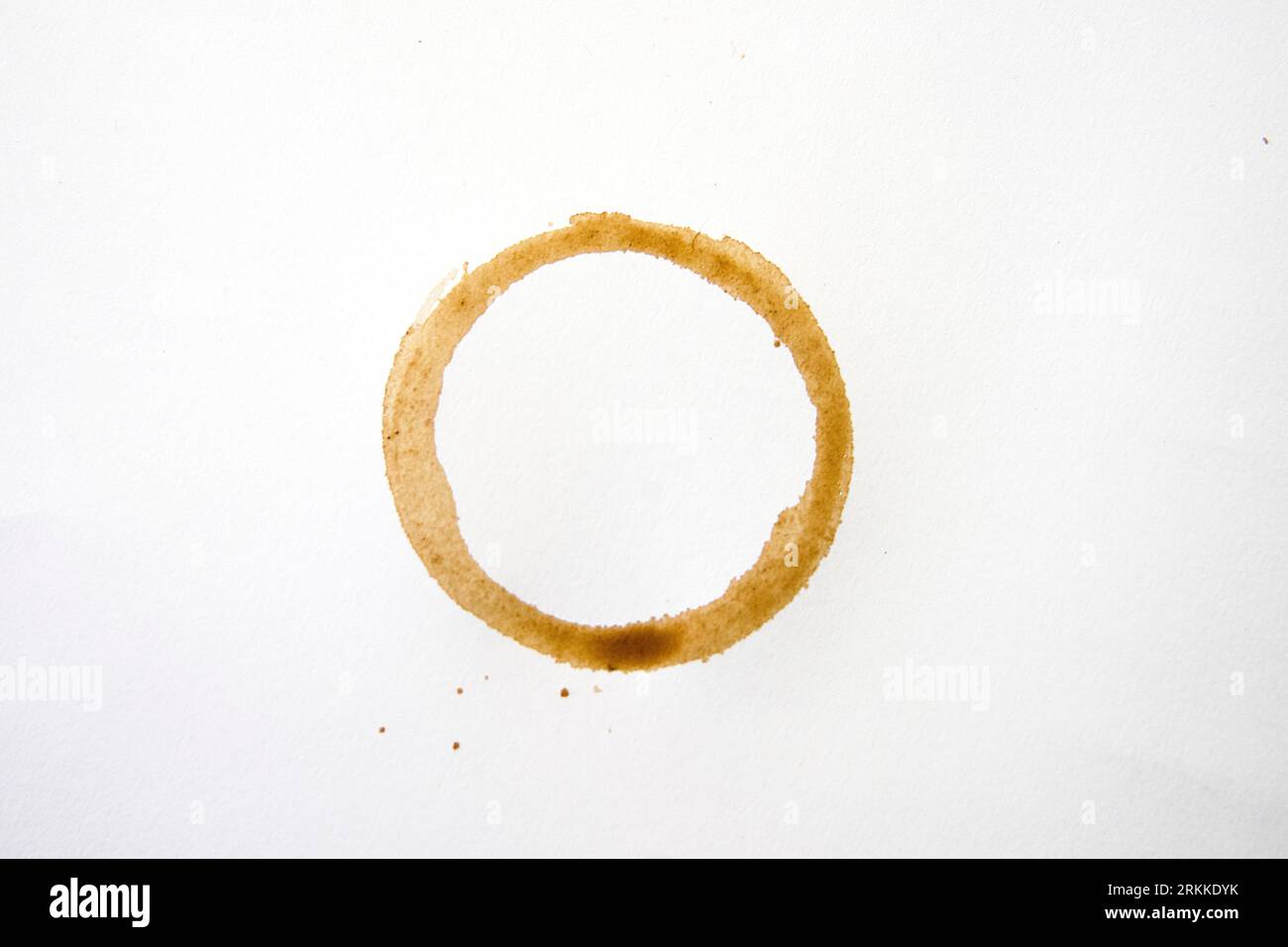 Coffee fence stain on white tablecloth Stock Photo