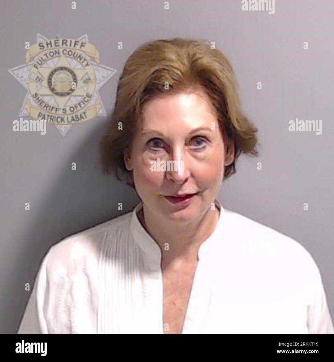Undated handout photo issued by Fulton County Sheriff's Office of the booking photo of Sidney Powell after she surrendered and was booked at the Fulton County Jail in Atlanta. Former US President Donald Trump and 17 others, who are accused by Fulton County District Attorney Fani Willis of scheming to subvert the will of Georgia voters to keep the Republican president in the White House after he lost to Democrat Joe Biden. Issue date: Friday August 25, 2023. Stock Photo