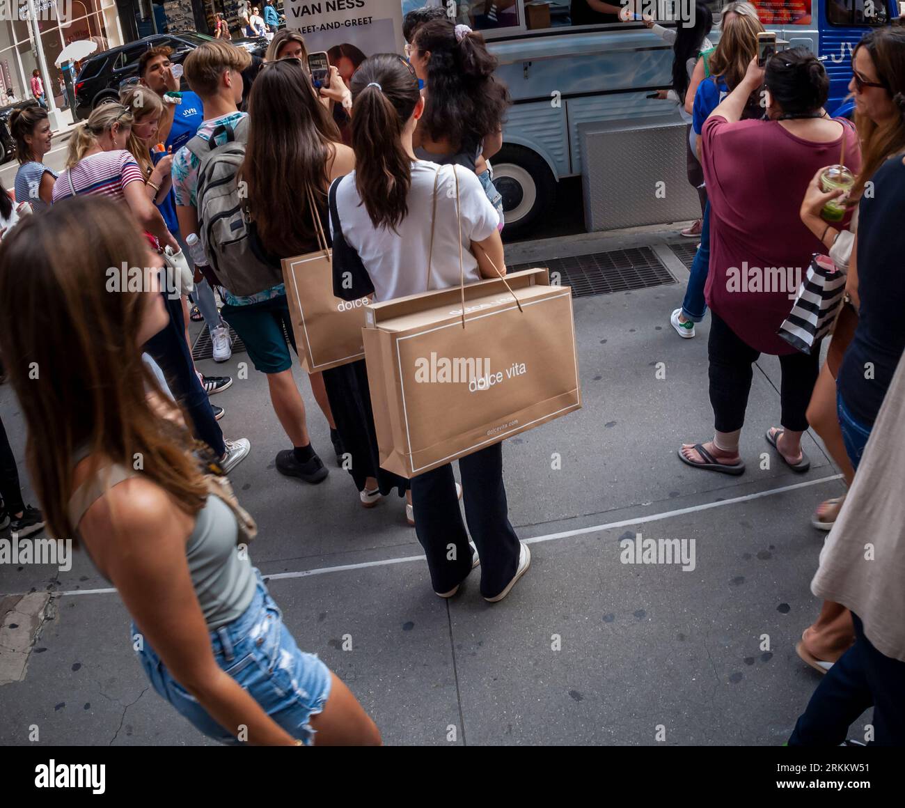 Shoppers with their Dolce Vita brand purchases in the Soho neighborhood of New York on Saturday, August 19, 2023.  (© Richard B. Levine) Stock Photo