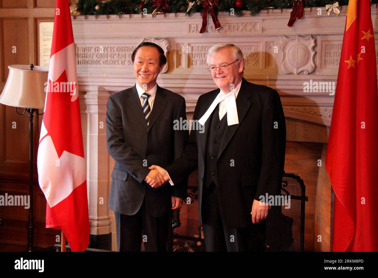 Bildnummer: 56545866  Datum: 21.10.2011  Copyright: imago/Xinhua (111202) -- OTTAWA, Dec. 2, 2011 (Xinhua) -- Canadian Senate Speaker Noel Kinsella (R) shakes hands with Wang Jiarui, head of the International Department of the Communist Party of China Central Committee, in a meeting room of the Senate on Parliament Hill in Ottawa, Ontario, Canada, on Oct. 21, 2011. Wang is leading a delegation of the Communist Party of China on a visit to Canada to further promote bilateral relations. (Xinhua/Zhang Dacheng)(ctt) CANADA-CHINA-CPC-WANG JIARUI PUBLICATIONxNOTxINxCHN People Politik x0x xtm 2011 qu Stock Photo