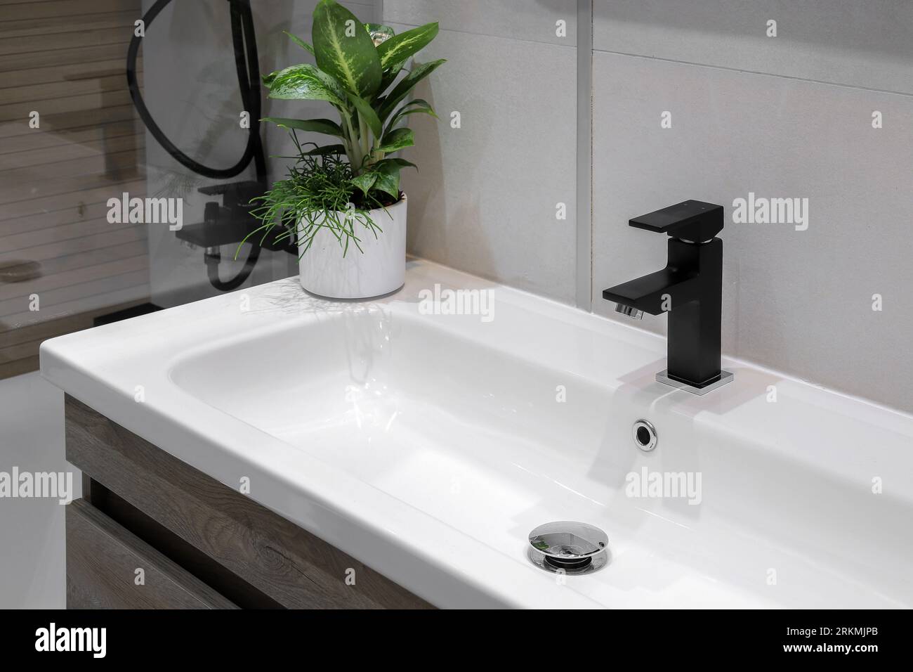 Black faucet with white ceramic sink in the bathroom Stock Photo Alamy