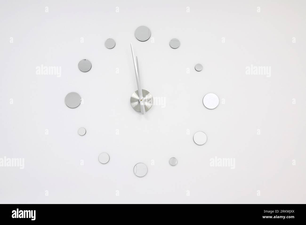 Big wall clock hanging on a white wall Stock Photo Alamy