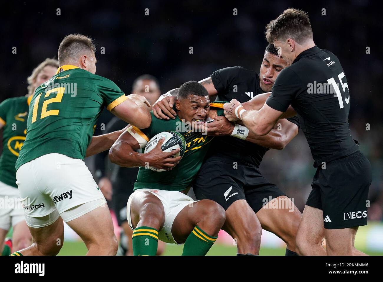 South Africa's Damian Willemse (centre) is tackled by New Zealand's Rieko Ioane (second from right) and New Zealand's Beauden Barrett during the international match at Twickenham Stadium, London. Picture date: Friday August 25, 2023. Stock Photo