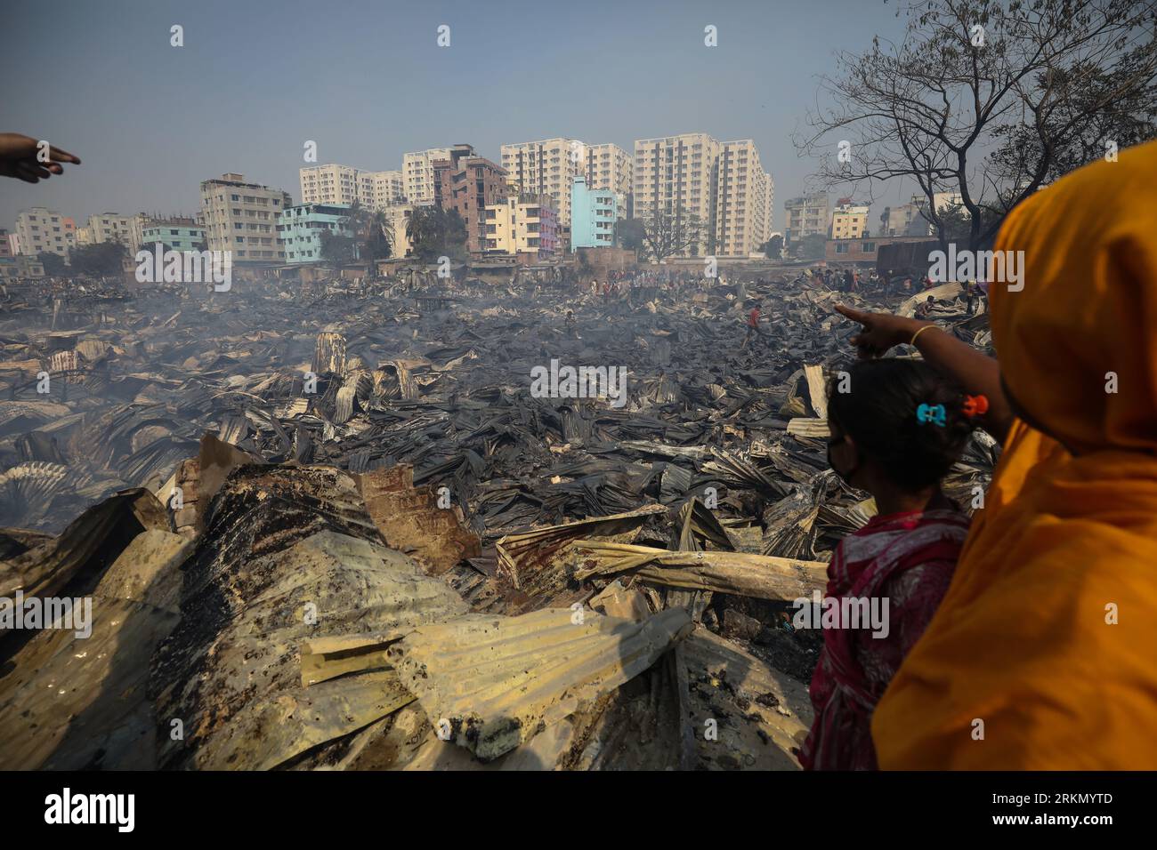 Out Rupnagar DHAKA, BANGLADESH-MARCH 11: People look for their belonged materials ...