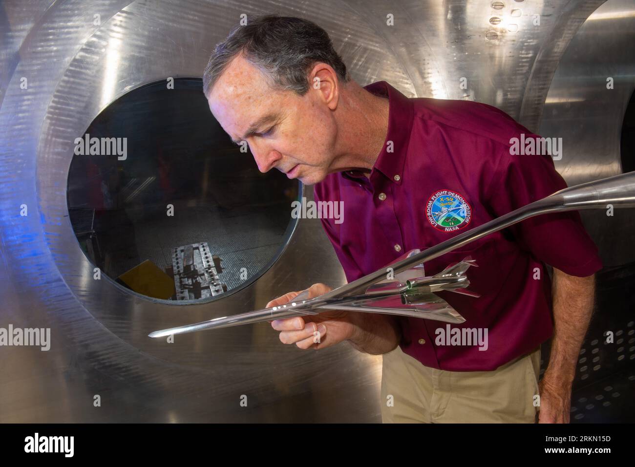 California, USA. 15th Oct, 2021. DON DURSTON was obsessed with building model planes as a kid, and he never grew out of it. His models are just a whole lot more sophisticated these days. Today, Durston, an aerospace engineer at NASA's Ames Research Center in California's Silicon Valley, leads the agency's wind tunnel testing for sonic boom research under the Commercial Supersonic Technology project. He is pictured here in October 2021 with a model he helped design of NASA's X-59 Quiet SuperSonic Technology, or QueSST, aircraft, made ready for testing in the 8- by 6-foot supersonic wind tun Stock Photo