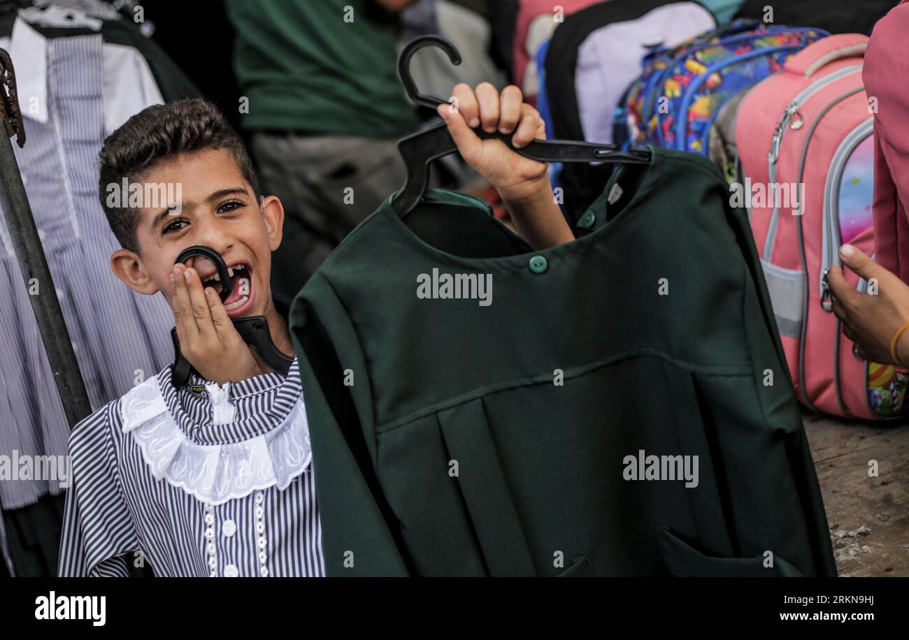 A Palestinian child seen with a school uniform during the preparation ...