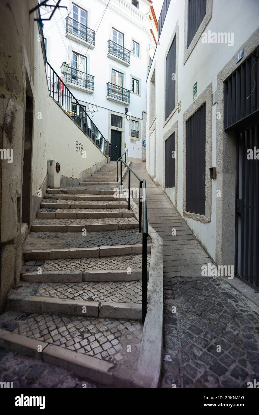 view of the streets of the Alfama neighborhood is one of the oldest and most touristic neighborhoods in Lisbon. August 25, 2023 Portugal Stock Photo