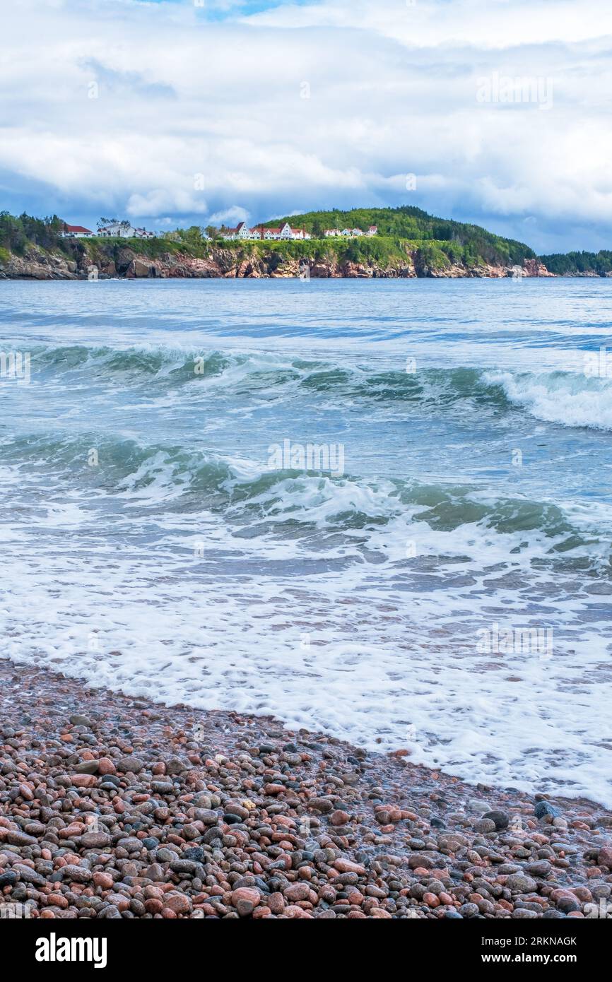 Waves crash onshore in the beautiful scene at Ingonish Beach Cape