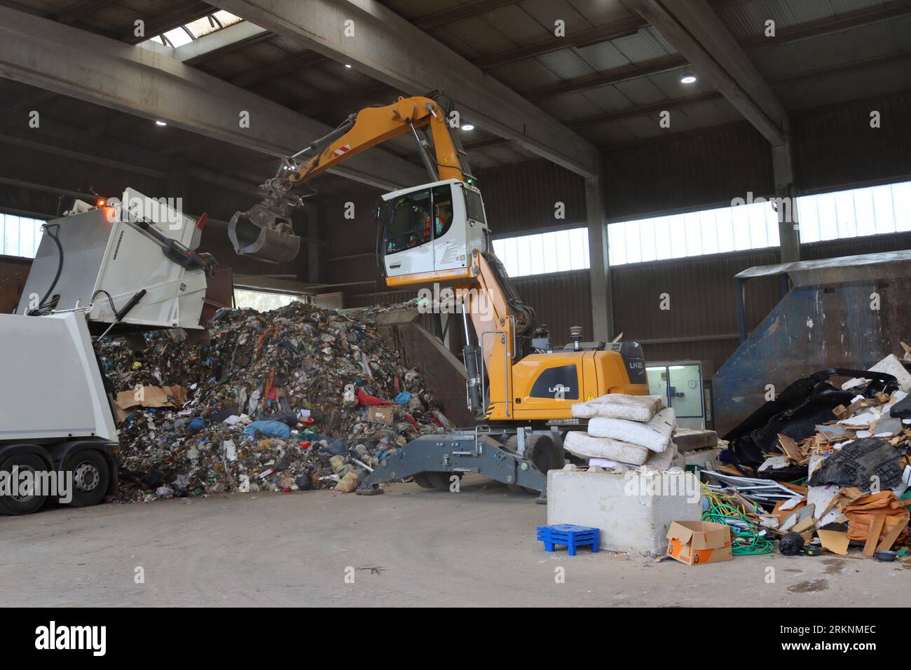 waste management centre - waste truck empties residual waste in a hall, Germany Stock Photo