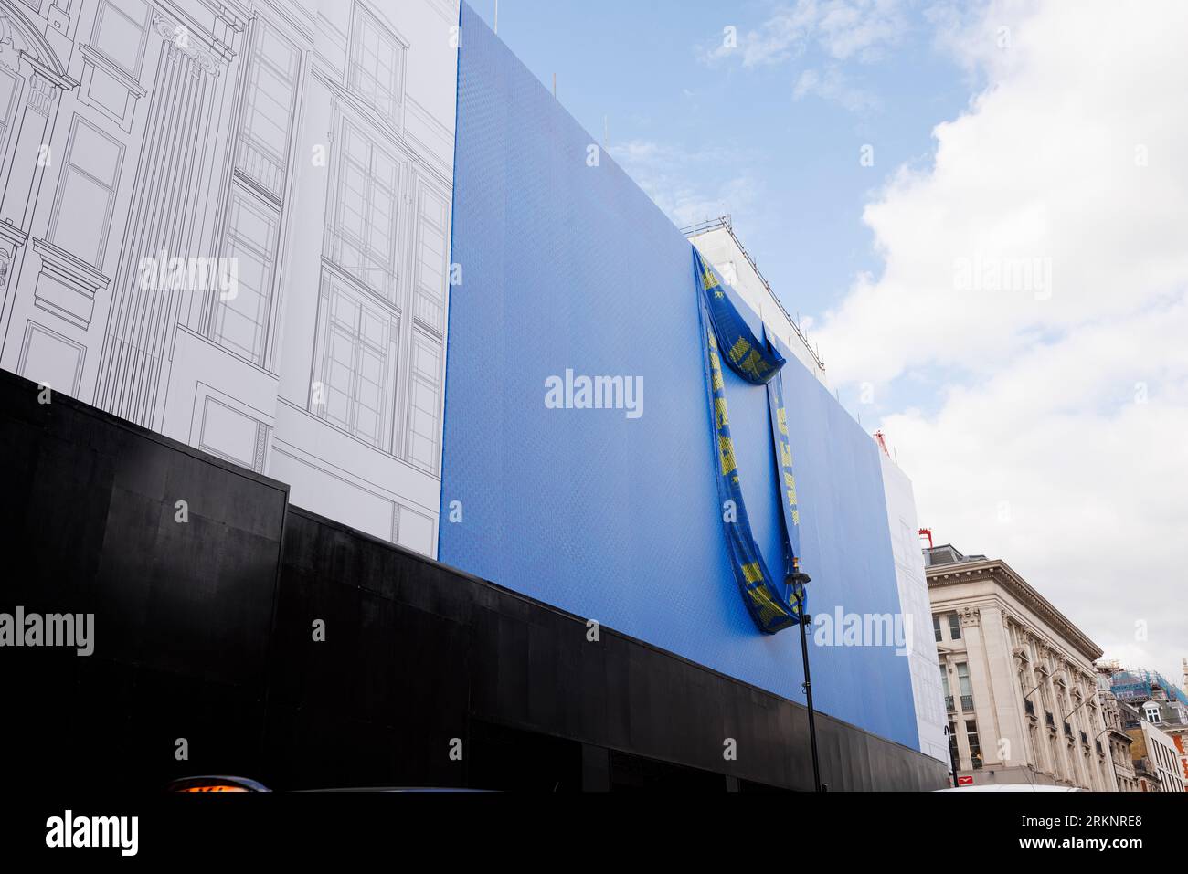 IKEA is set to open a store on Oxford Street in early 2024, the building is currently covered in scaffolding designed to look like a giant IKEA blue b Stock Photo