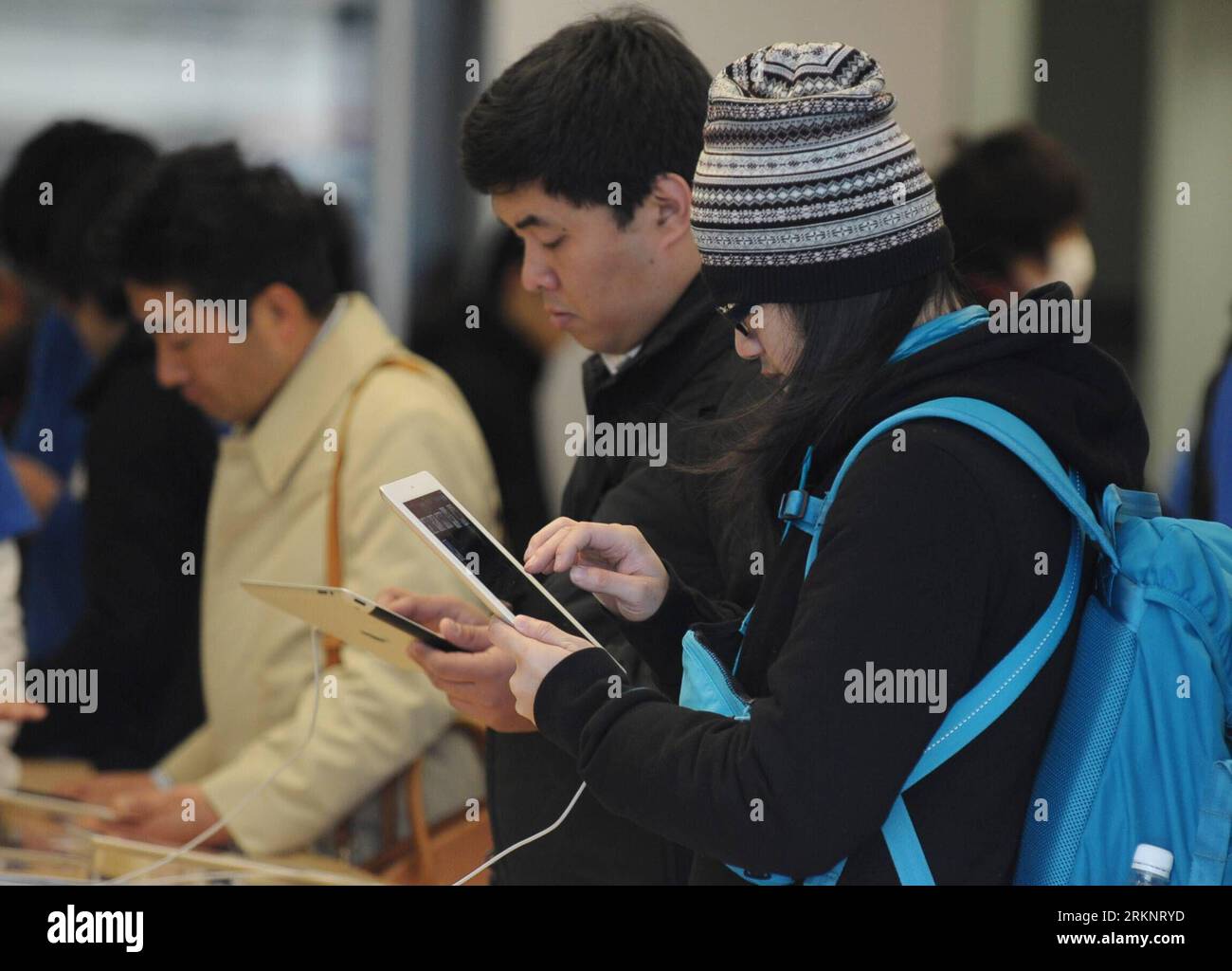 フー With their new apple ipad 3 hi-res stock photography and images