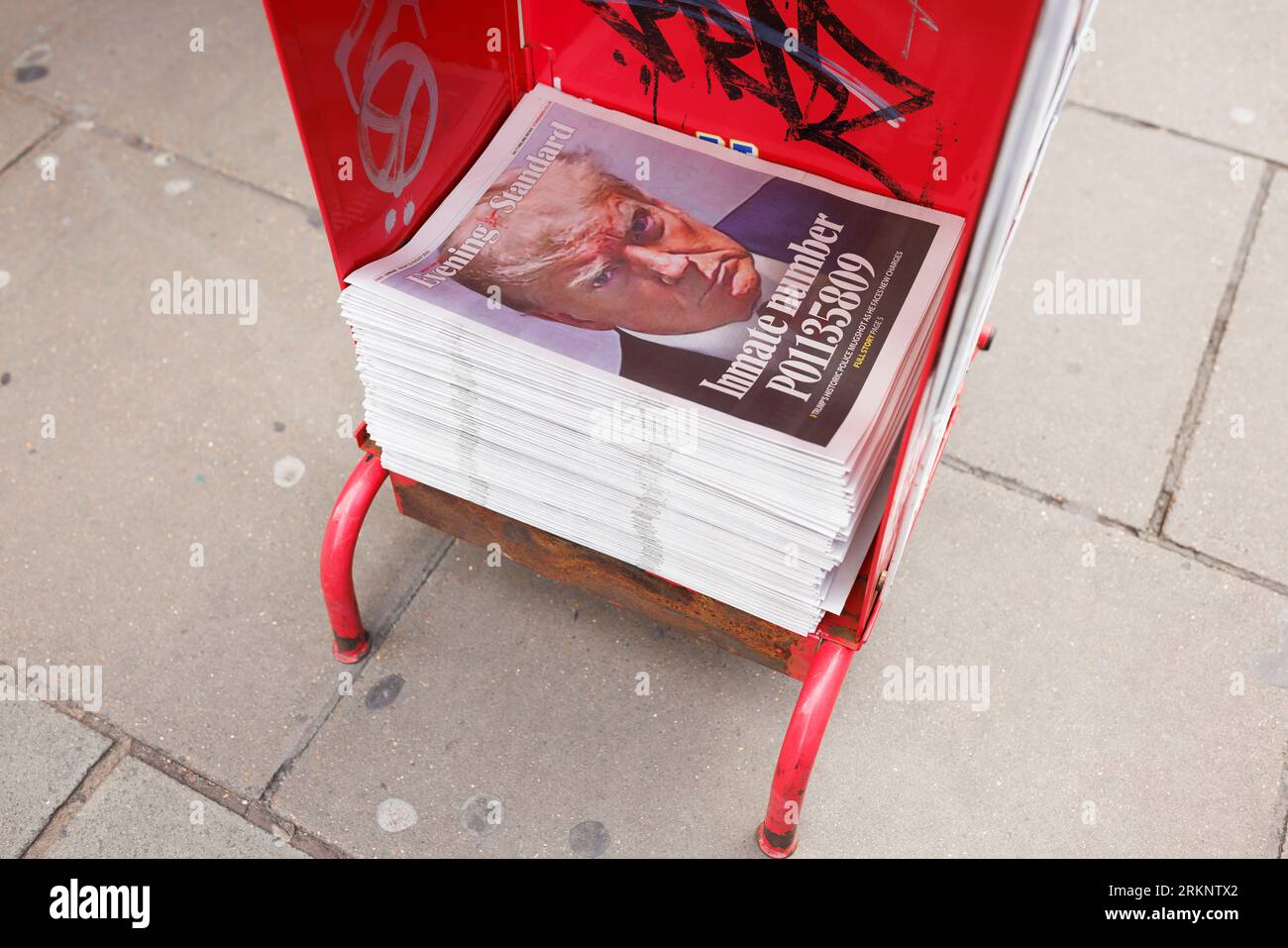 Police mug shot of Former President Donald John Trump on the front of the London Evening Standard newspaper, displayed on a newsstand in Oxford Circus Stock Photo