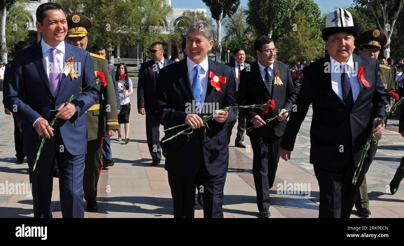 Bildnummer: 57973272  Datum: 09.05.2012  Copyright: imago/Xinhua (120509) -- BISHKEK, May 9, 2012 (Xinhua) -- Kyrgyz President Almazbek Atambayev (C), Speaker of Parliament Asylbek Jeenbekov (R) and Prime Minister Omurbek Babanov walk towards Eternal Flame in Bishkeke, capital of Kyrgyzstan, May 9, 2012. Commemorations dedicated to the 67th anniversary of Victory in Great Patriotic War of 1941-1945 were held here Wednesday. (Xinhua) (dzl) KYRGYZSTAN-VICTORY DAY-67TH ANNIVERSARY PUBLICATIONxNOTxINxCHN People Politik Gedenken Kriegsende Zweiter Weltkrieg 2 x0x xst premiumd 2012 quer      5797327 Stock Photo