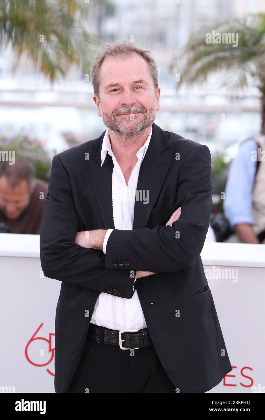 (120518) -- CANNES, May 18, 2012 (Xinhua) -- Austrian director Ulrich Seidl poses for photos during a photocall for Austrian film Paradies:Liebe at the 65th Cannes Film Festival, southern France, on May 18, 2012. Paradies: Liebe will compete with the other 21 feature films for 2012 Golden Palm (Palme d Or), the most prestigious award of the 65th Cannes International Film Festival. (Xinhua/Gao Jing) (zjl) FRANCE-CANNES-FILM FESTIVAL-PHOTOCALL-PARADIES:LIEBE PUBLICATIONxNOTxINxCHN Stock Photo
