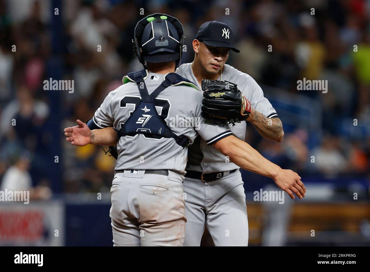 New York Yankees relief pitcher Jonathan Loaisiga hugscatcher Ben