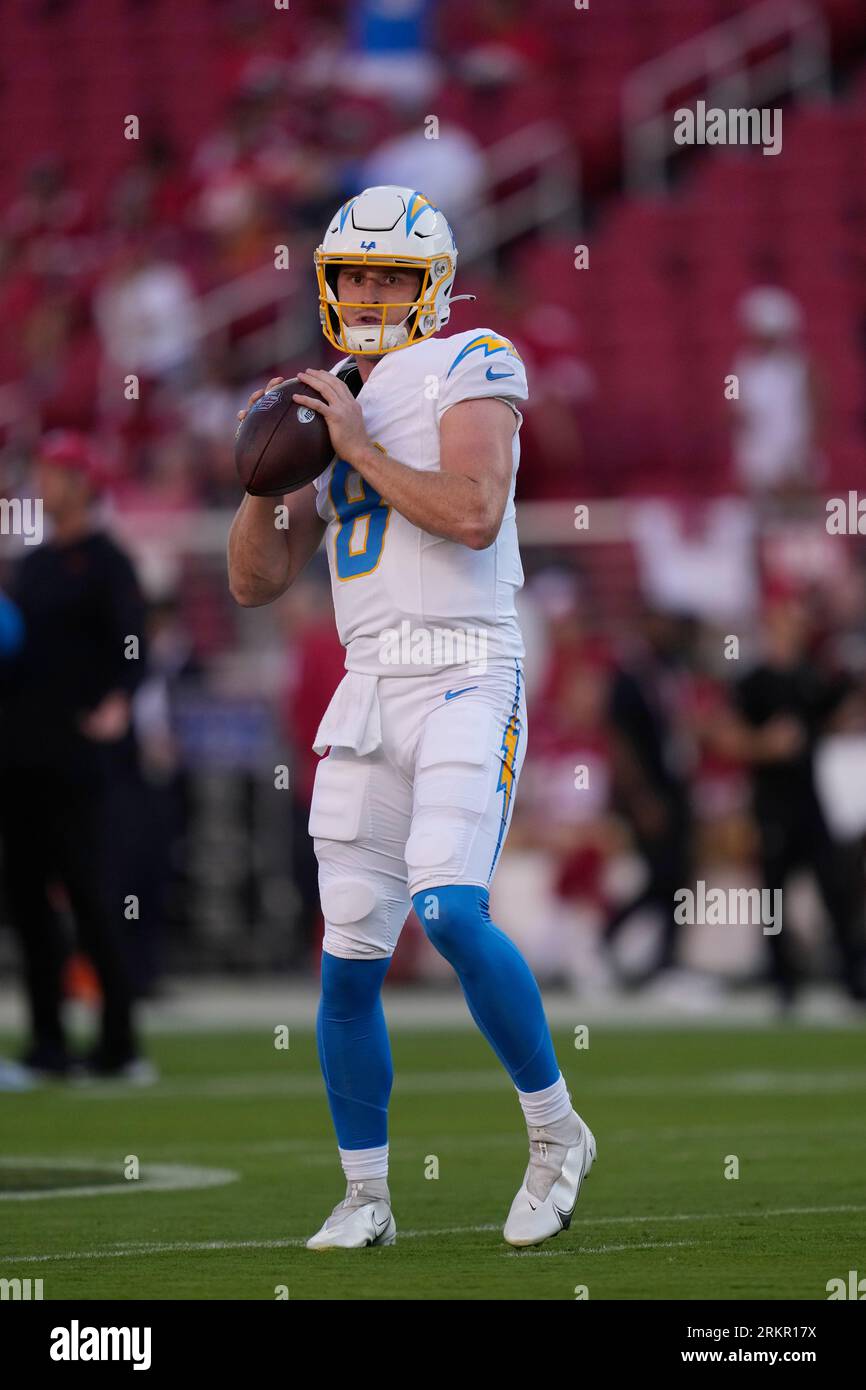 Los Angeles Chargers quarterback Max Duggan (8) warms up before a