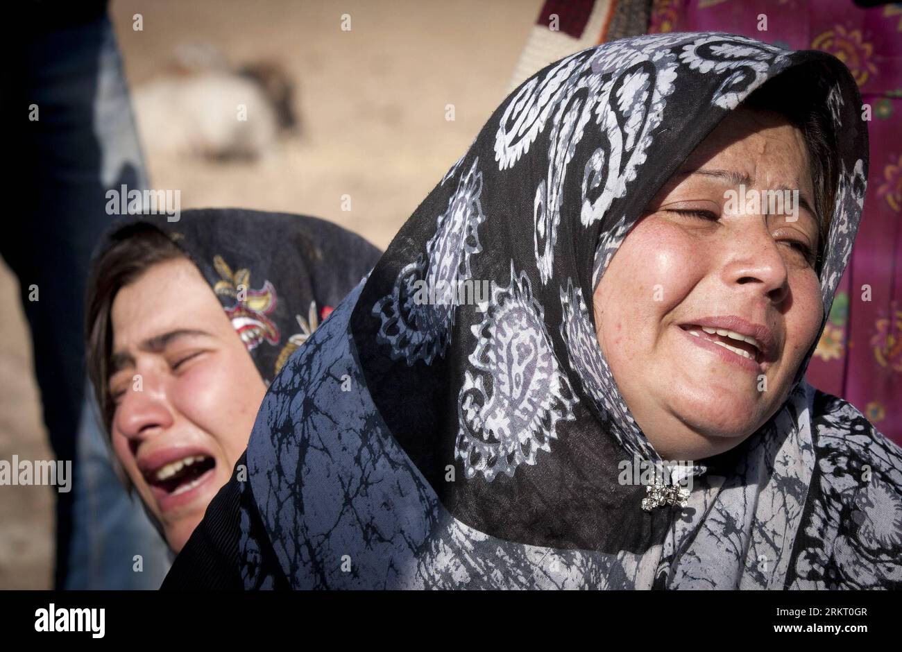 Bildnummer: 58338507  Datum: 12.08.2012  Copyright: imago/Xinhua (120812) -- TEHRAN, Aug. 12, 2012 (Xinhua) -- Two Iranian women cry after an earthquake in Varzaqan in northwest Iran, on Aug. 12, 2012. The death toll of Saturday s strong twin quakes in northwest Iran has risen to some 300, the semi- official Fars news agency cited an official as saying on Sunday. (Xinhua/Ahmad Halabisaz) IRAN-EARTHQUAKE PUBLICATIONxNOTxINxCHN Gesellschaft Iran Katastrophe Naturkatastrophe Erdbeben x0x xst premiumd 2012 quer      58338507 Date 12 08 2012 Copyright Imago XINHUA  TEHRAN Aug 12 2012 XINHUA Two Ira Stock Photo
