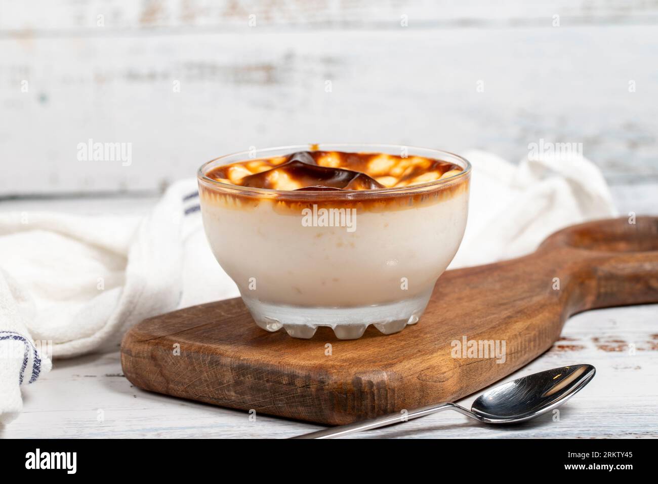 Rice pudding. Fresh delicious rice pudding on a white background. Mild dessert with milk and rice. Traditional Turkish cuisine delicacies. Local name Stock Photo