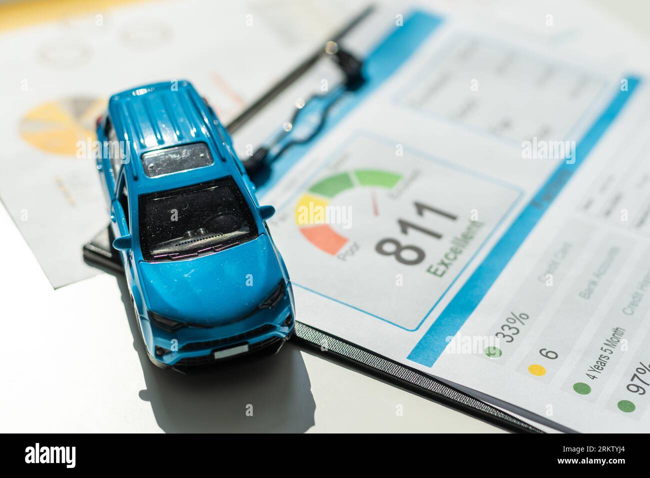 Front view of a blue toy car on sheets drawings Stock Photo - Alamy