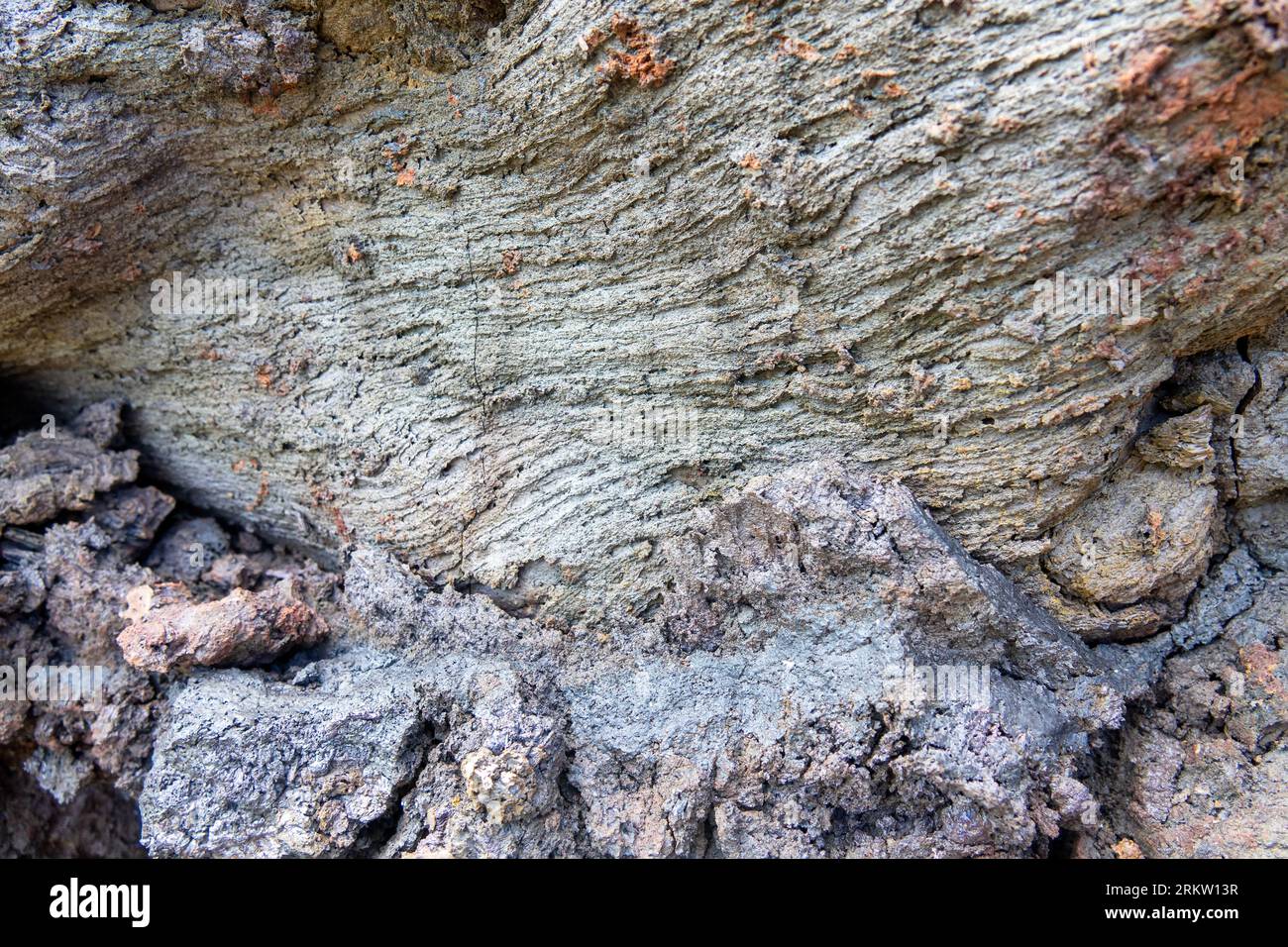 A variety of forms of basalt solidified lava. Viscous volcanic lava cemented with sand, pumice and breccia tephra (volcanic ash). Kamchatka, Russia Stock Photo