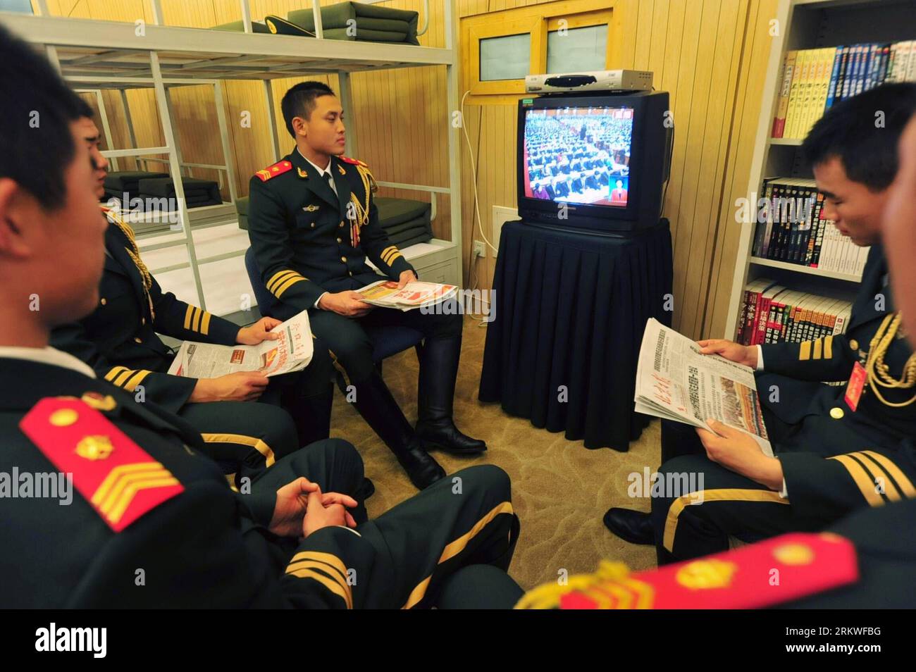 Bildnummer: 58678731  Datum: 08.11.2012  Copyright: imago/Xinhua (121108) -- BEIJING, Nov. 8, 2012 (Xinhua) -- Soldiers of armed police watch live TV report on the opening ceremony of the 18th National Congress of the Communist Party of China (CPC) in Beijing, capital of China, Nov. 8, 2012. The 18th CPC National Congress was opened in Beijing on Thursday. (Xinhua/Liu Changlong) (hdt) (CPC CONGRESS) CHINA-18TH CPC NATIONAL CONGRESS (CN) PUBLICATIONxNOTxINxCHN Politik Parteitag xas x0x 2012 quer      58678731 Date 08 11 2012 Copyright Imago XINHUA  Beijing Nov 8 2012 XINHUA Soldiers of Armed Po Stock Photo