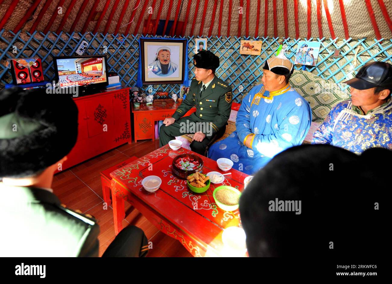 Bildnummer: 58678740  Datum: 08.11.2012  Copyright: imago/Xinhua (121108) -- SONID YOUQI, Nov. 8, 2012 (Xinhua) -- Police officers, along with herdsmen, watch live TV report on the opening ceremony of the 18th National Congress of the Communist Party of China (CPC) in Sonid Youqi Banner, north China s Inner Mongolia Autonomous Region, Nov. 8, 2012. The 18th CPC National Congress was opened in Beijing on Thursday. (Xinhua/Ren Junchuan)(hdt) (CPC CONGRESS) CHINA-18TH CPC NATIONAL CONGRESS (CN) PUBLICATIONxNOTxINxCHN Politik Parteitag xas x0x 2012 quer      58678740 Date 08 11 2012 Copyright Imag Stock Photo