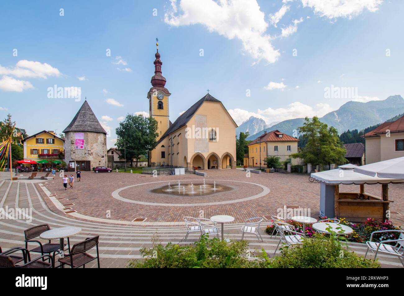 Tarvisio, Italy (25th August 2023) - Piazza Unità square with the church of saints Peter and Paul Stock Photo
