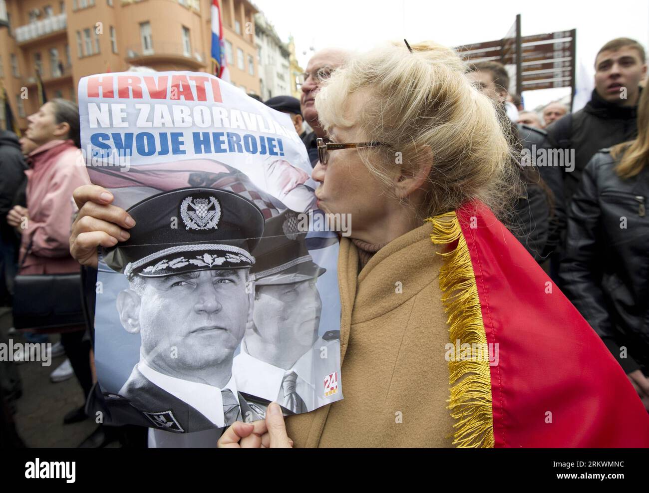 Bildnummer: 58710689  Datum: 16.11.2012  Copyright: imago/Xinhua (121116) -- ZAGREB, Nov. 16, 2012 (Xinhua) -- A senior woman kisses a photo of two Croatian military officers in Zagreb, capital of Croatia, on Nov. 16, 2012. An UN court on Friday overturned convictions of two senior Croatian military officers charged with war crimes during the Balkan conflict in the 1990s. The appeals chamber of the International Criminal Tribunal for the former Yugoslavia (ICTY) acquitted Ante Gotovina and Mladen Markac, and ordered the pair s immediate release. (Xinhua/Miso Lisanin) (lr) CROATIA-ZAGREB-TWO SE Stock Photo