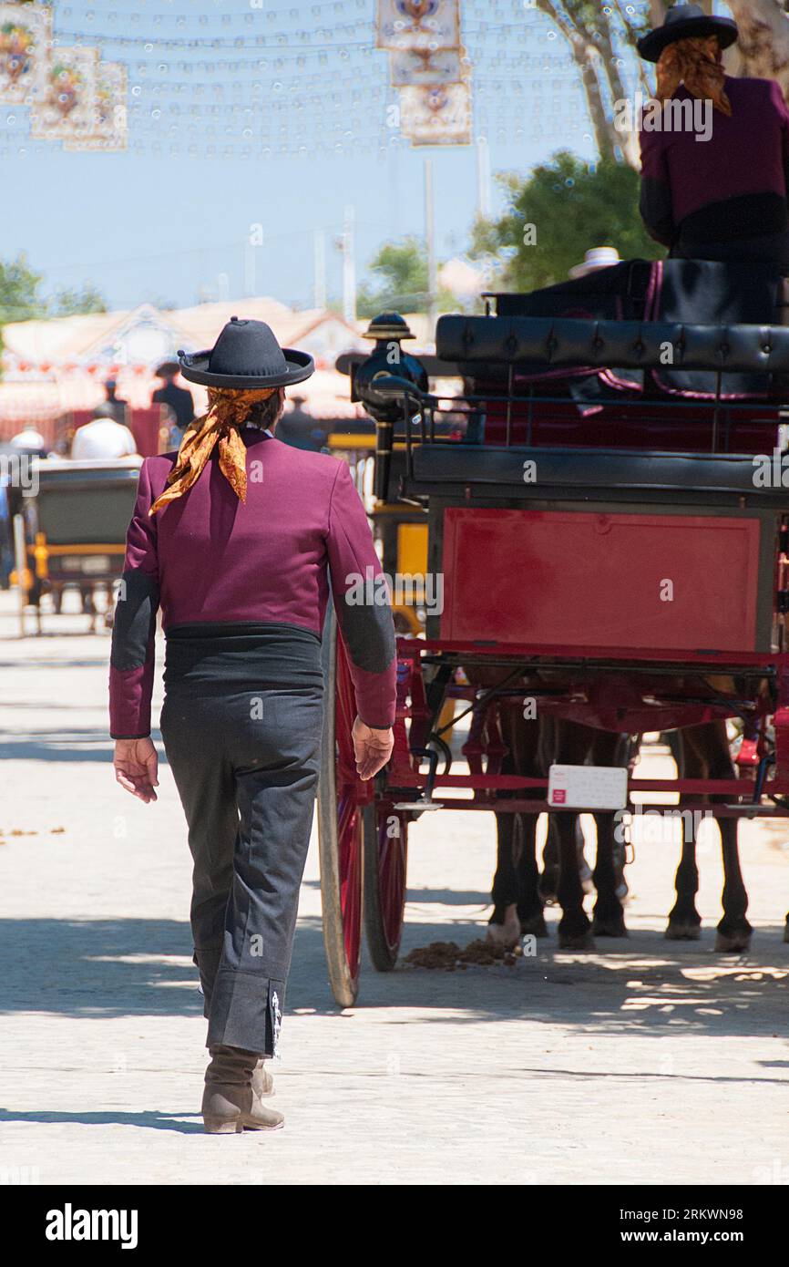 man arriving at a horse-drawn carriage at the April fair Stock Photo