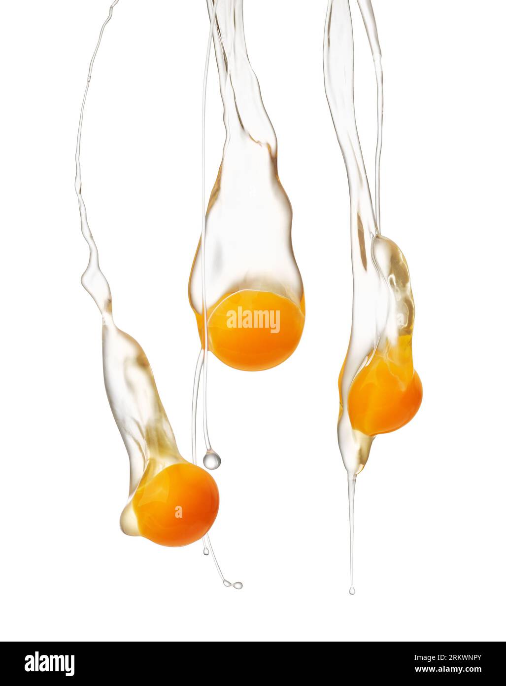 Egg yolk and white falling down over white background Stock Photo