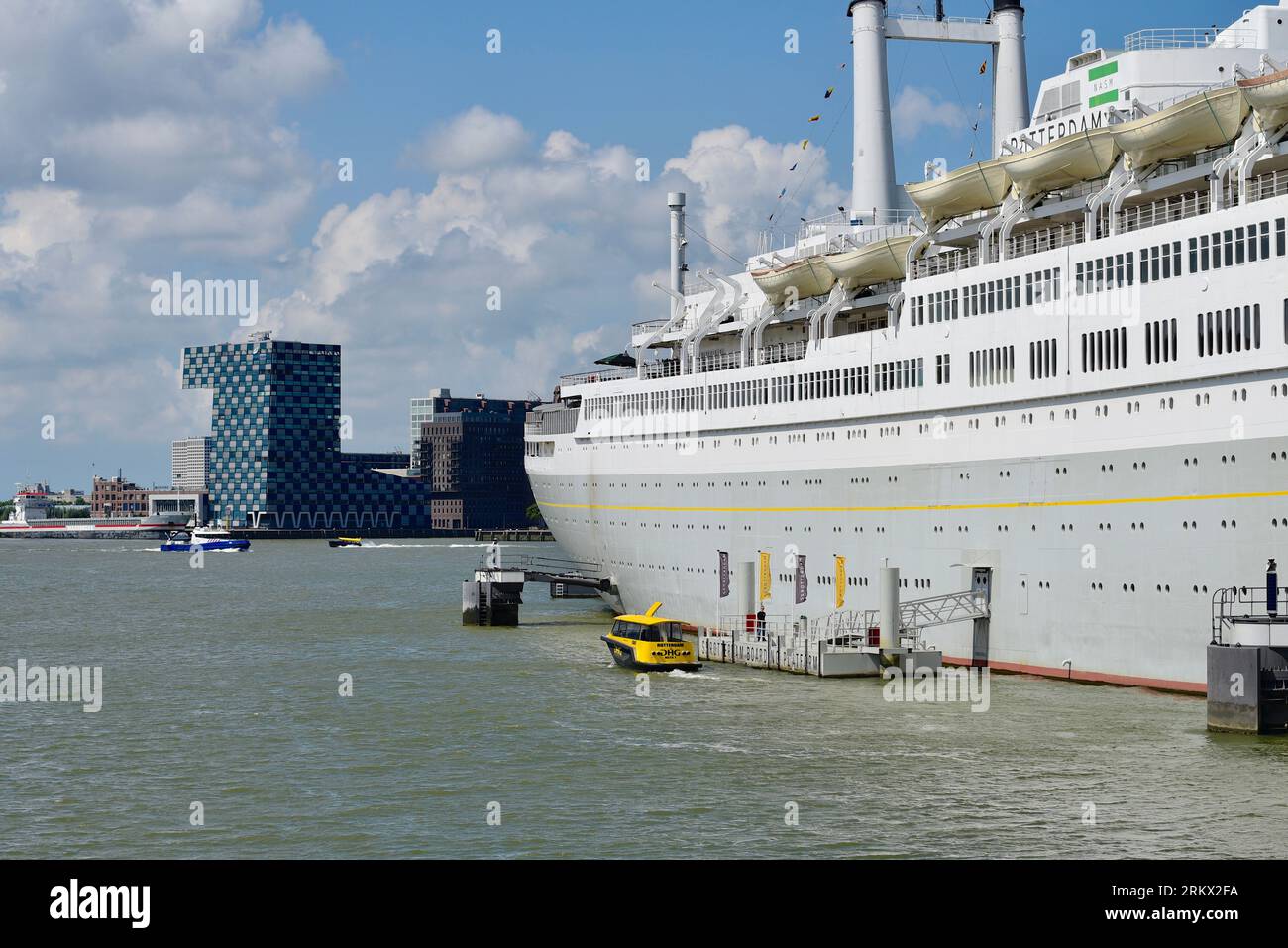 A Rotterdam water taxi moors at the boarding platform of the ship Rotterdam; visitors have direct access to the ship here Stock Photo