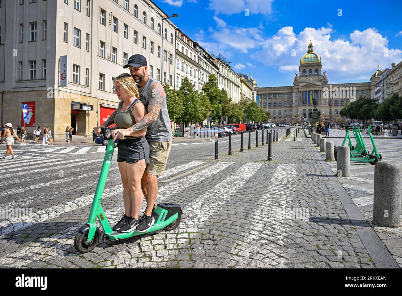 Prague, Czech Republic. 22nd Aug, 2023. A man and a woman ride on a shared  electric scooter of the company Bolt on Wenceslas Square, August 22, 2023,  Prague. Credit: Vit Simanek/CTK Photo/Alamy