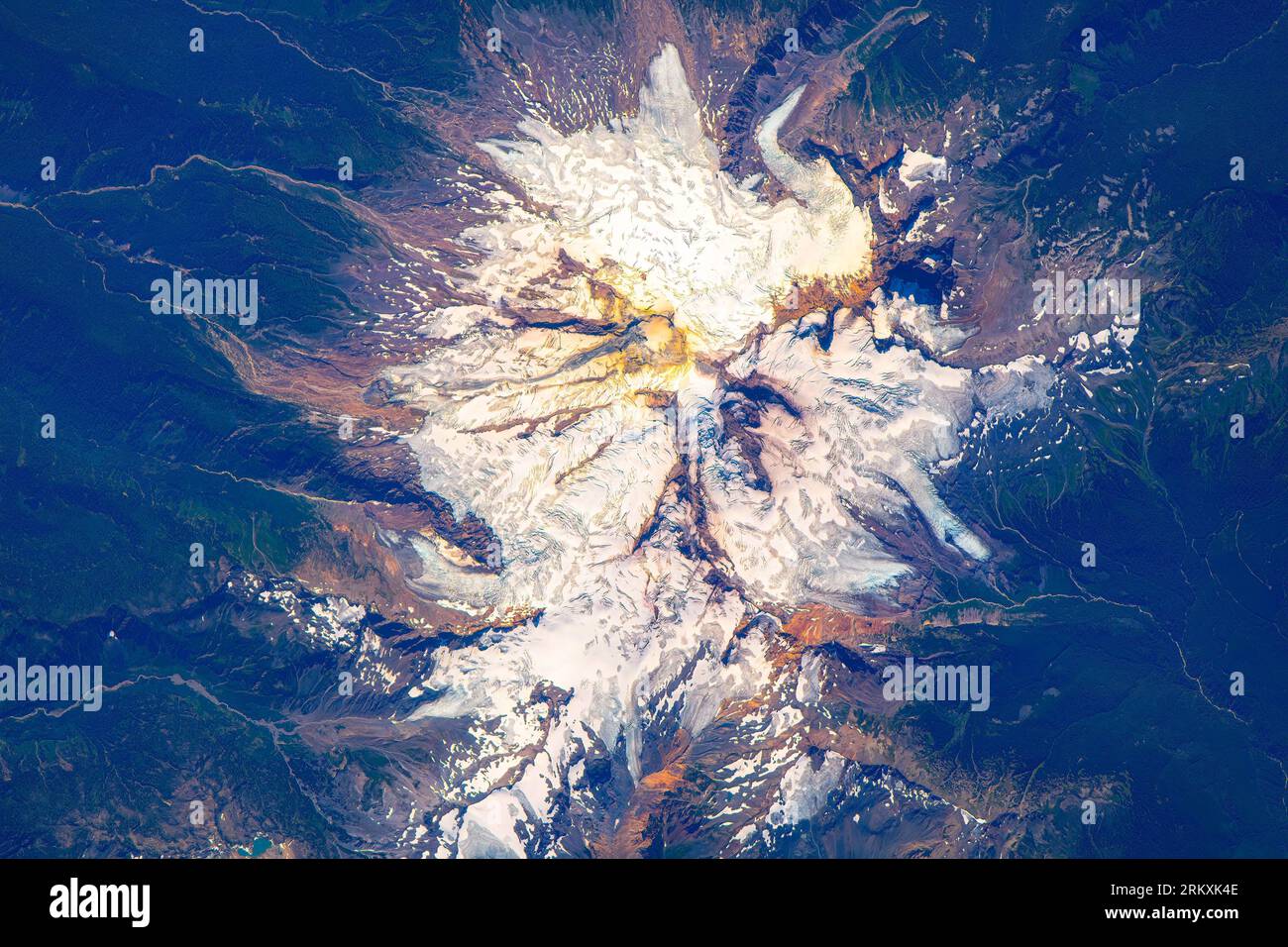 Snowcapped mountain in British Columbia, Canada. The ISS flies in the proximity of Vancouver city. Digital enhancement of an image by NASA. Stock Photo