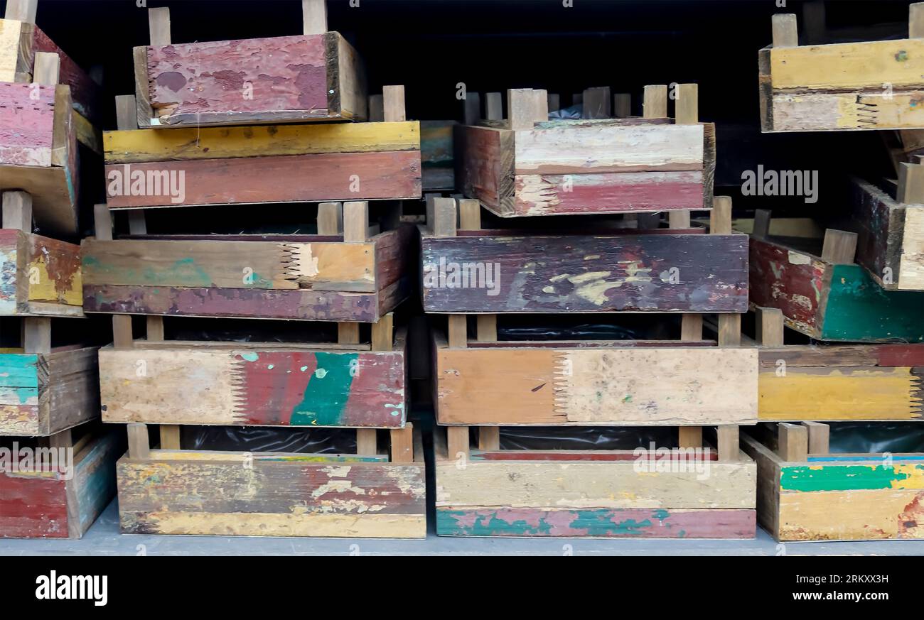 Vintage Wooden Crates In A Shelf For Sale In A Small Shop Stock Photo