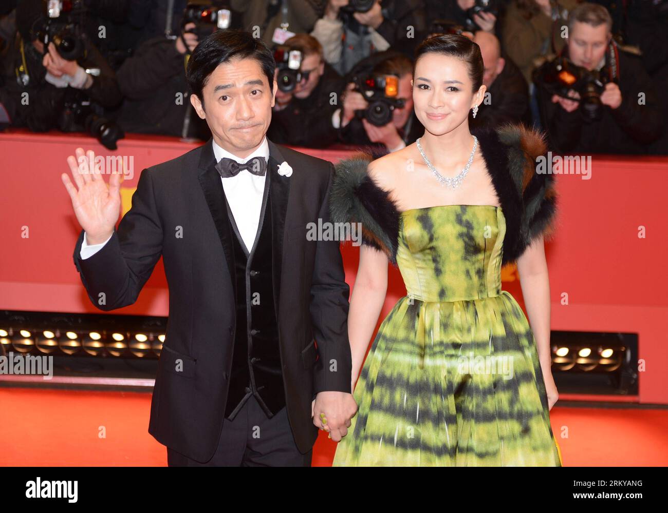 Bildnummer: 59188759  Datum: 07.02.2013  Copyright: imago/Xinhua Chinese actor Tony Leung (L) and Chinese actress Zhang Ziyi arrive on the red carpet for the opening ceremony of the 63rd Berlin film festival in Berlin, Germany, on Feb. 7, 2013. The 63rd Berlin film festival opened Thursday with a martial arts epic The grandmaster of Chinese director Wong Kar Wai who will also lead the jury of this Berlinale. (Xinhua/Ma Ning) GERMANY-BERLIN-ENTERTAINMENT-FILM-FESTIVAL PUBLICATIONxNOTxINxCHN Kultur Entertainment People Film Festival Filmfestival 63 Internationale Berlinale x0x xdd premiumd 2013 Stock Photo