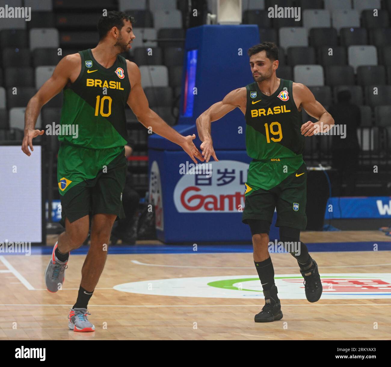 Jakarta, Indonesia. 26th Aug, 2023. Raul Neto Togni (R) and Tim Soares of Brazil clap hands during the Group G first round match between Iran and Brazil at the FIBA World Cup 2023 in Jakarta, Indonesia, Aug. 26, 2023. Credit: Zulkarnain/Xinhua/Alamy Live News Stock Photo