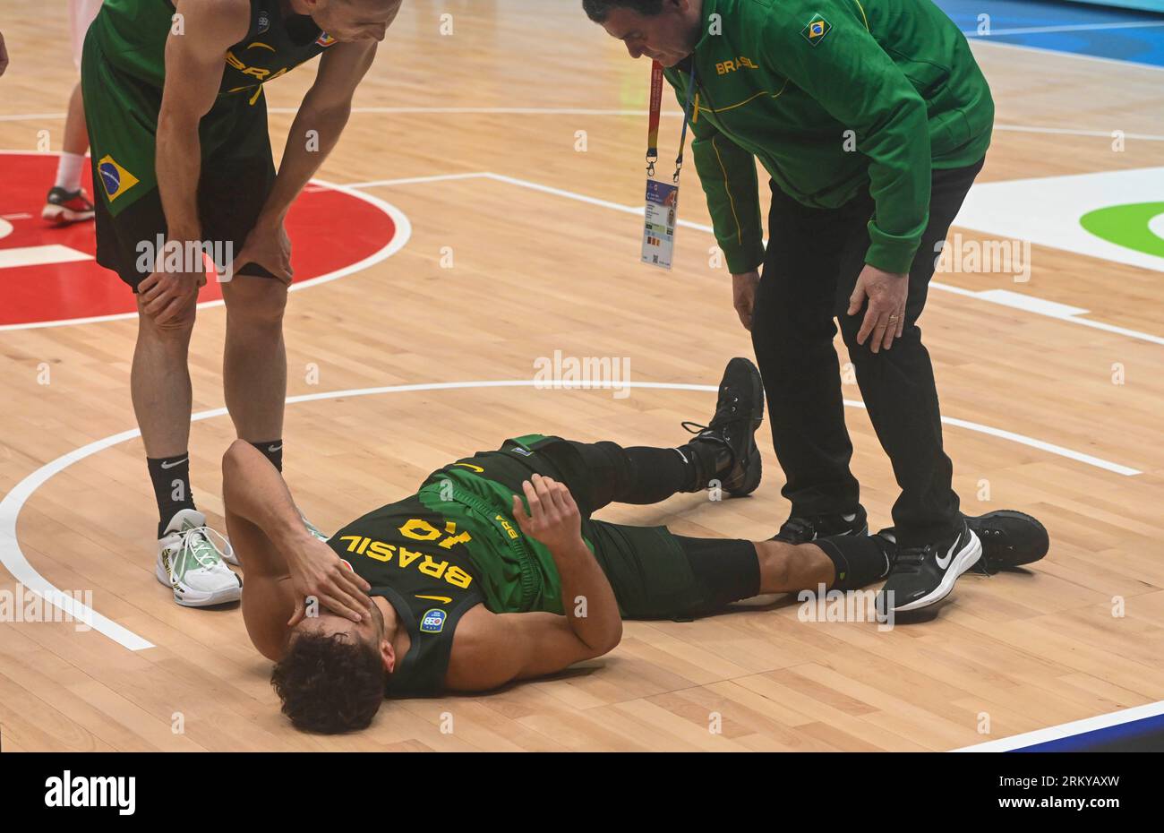 Jakarta, Indonesia. 26th Aug, 2023. Raul Neto Togni (C) of Brazil falls down during the Group G first round match between Iran and Brazil at the FIBA World Cup 2023 in Jakarta, Indonesia, Aug. 26, 2023. Credit: Zulkarnain/Xinhua/Alamy Live News Stock Photo