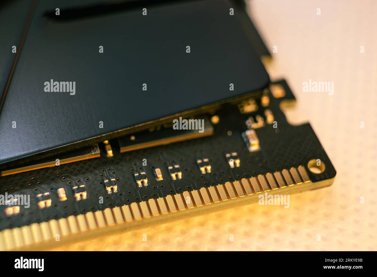 DDR4 DRAM memory module golden electrical contact macro. Computer RAM chip close-up. Desktop PC memory for assemble Stock Photo
