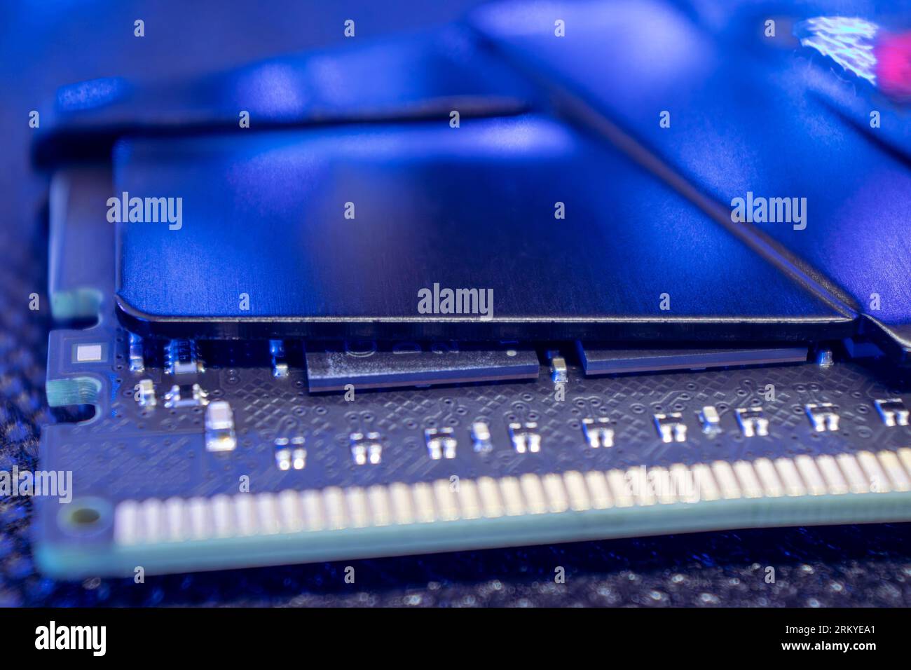 Memory module DDR4 DRAM macro in blue light. Computer RAM chipset close-up. Desktop PC hardware components Stock Photo