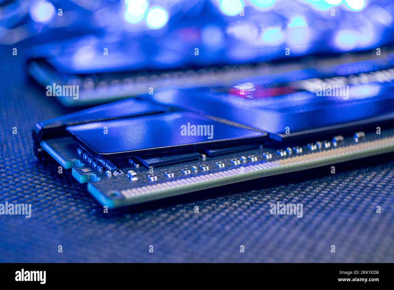 Memory module DDR4 DRAM macro in blue light. Computer RAM chipset. Desktop PC hardware components Stock Photo