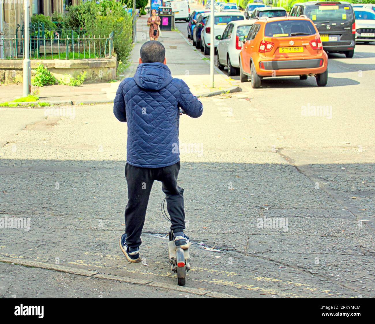 Glasgow, Scotland, UK. 26tht August, 2023. UK Weather:  Electric scooter on the pavement crossing road. Sunny in the city saw locals ant tourists make the most of the city centre.  Credit Gerard Ferry/Alamy Live News Stock Photo