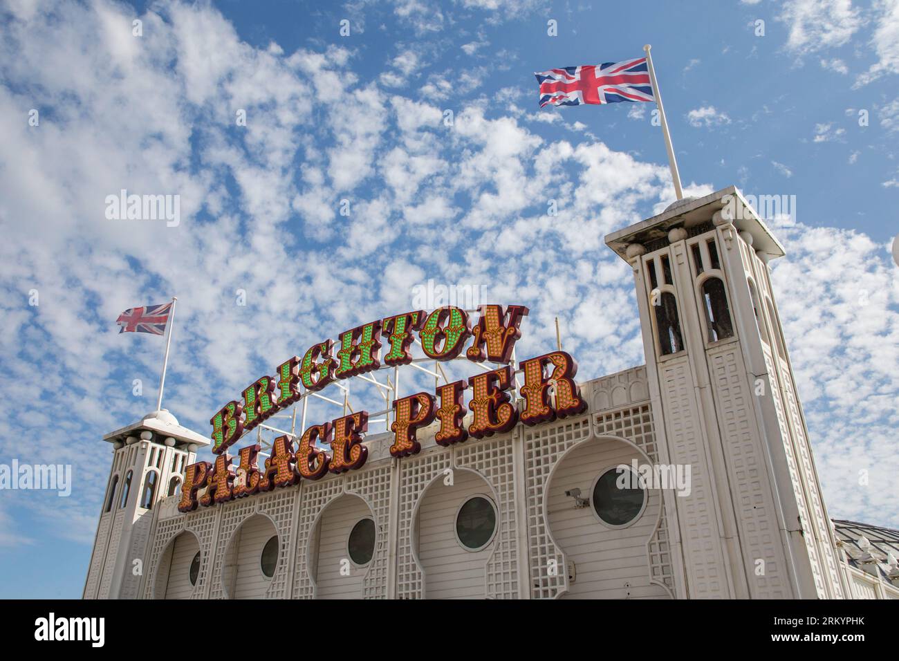 Brighton Pier neon sign with bright blue skies Stock Photo