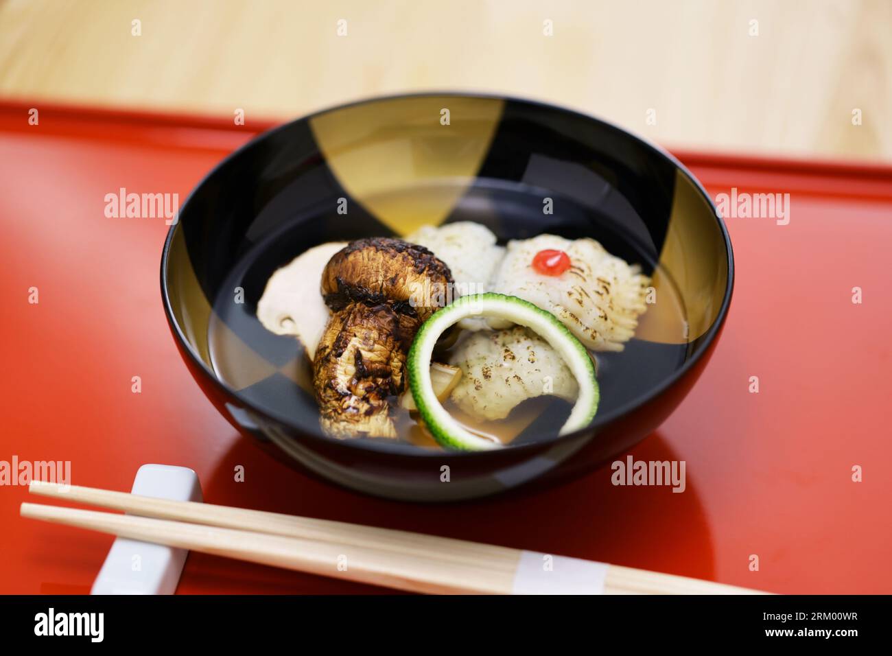Suimono (Japanese style clear soup) with Matsutake mushroom and Hamo( pike conger eel). Stock Photo